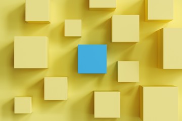 Wall Mural - outstanding blue box among yellow boxes on yellow background. minimal flat lay contept