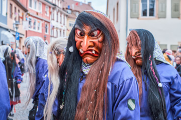 Ugly witch with long black brown hair. Street Carnival in Southern Germany - Black Forest.