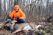 © Dave Willman - Hunter with a Harvested Whitetail Buck