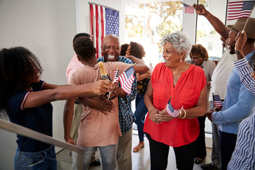 Wall Mural - Three generation black family celebrating Independence Day at home together,close up