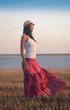 © erainbow - Woman,  coast, pink skirt, white t-shirt,  hat, happy