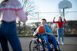 © Daisy Daisy - Teenage Boy In Wheelchair Playing Basketball With Friends