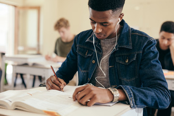 Student during lecture in college classroom