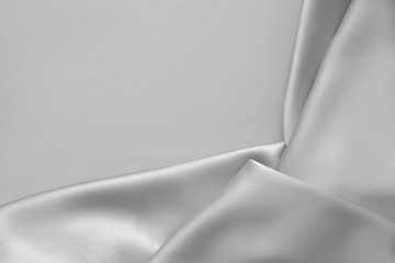 Rippled white silk fabric satin cloth waves background