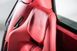 Red leather headrest of exotic car