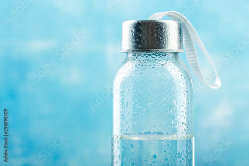 Small glass water bottle Wallpaper Mural