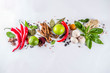 Various herbs and spices on white background top view copy space