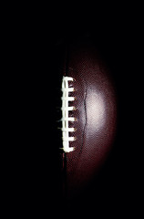 Wall Mural - American football ball isolated on black background