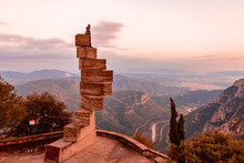 Young Man Standing On Top Of The World Near Montserrat In Spain.