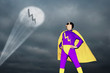 Superhero being signalled by spotlight