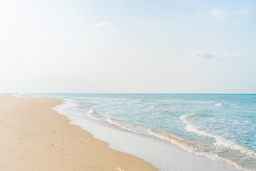 tropical nature clean beach and white sand in summer with sun light blue sky and bokeh background.