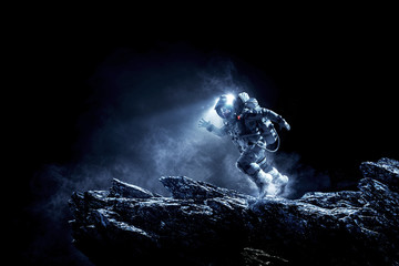 Wall Mural - Spaceman running fast. Mixed media
