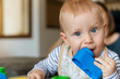 © Stock Rocket - Beautiful baby boy playing with toy