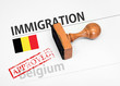 Approved Immigration Belgium application form with rubber stamp
