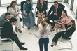 © InfiniteFlow - Businesswomen and businessmen attending group meeting conference in office room. Corporate business team concept.