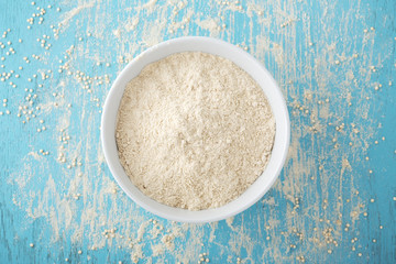 Quinoa flour in white bowl