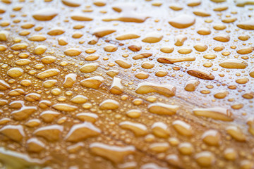 Rain or water drops on wood background 