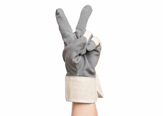 Worker showing gesture - two fingers, victory sign. Male hand wearing working glove with, isolated on white background.