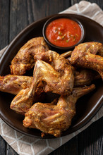 Grilled Rabbit Legs With Spicy Tomato Dip.