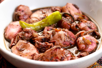 Wall Mural - A tasty squid dish with soy sauce in white bowl. Adobong Pusit from Philippines.