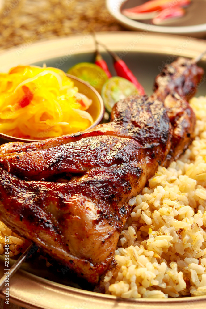 Delicious Chicken Inasal with rice. Filipino cuisine. Stock Photo ...
