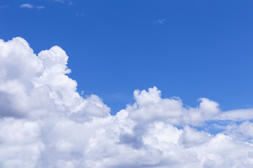 Blue sky background with white clouds, rain clouds on sunny summer or spring day.