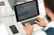 © yurolaitsalbert - close up.a businessman uses a laptop to work with financial data