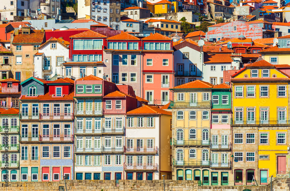 Old historical houses of Porto. Rows of colorful buildings in the traditional architectural style, Portugal - obrazy, fototapety, plakaty 