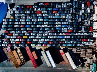 Aerial view of used cars lined up in the port