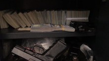 Currency and guns inside of a safe