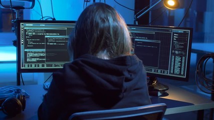 Poster - cybercrime, hacking and technology concept - female hacker in dark room creating code or using computer virus program for cyber attack