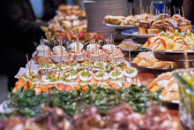Pinchos And Tapas Typical Of The Basque Country, Spain. Selection Of Different Types Of Foods To Choose From. San Sebastian