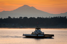 Ferry Boat With Mt. Baker In The Background. A Small Ferry Boat From Lummi Island, Washington, Makes The Crossing To Gooseberry Point On The Mainland Near The City Of Bellingham.