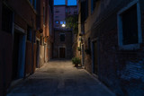 Fototapeta Uliczki - narrow Venetian street surrounded by colourful building