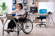 © Elnur - Female employee in wheel-chair at the office