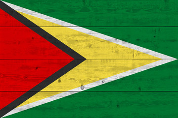 Wall Mural - Guyana flag painted on old wood plank