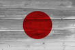 © Visual Content - Japan flag painted on old wood plank