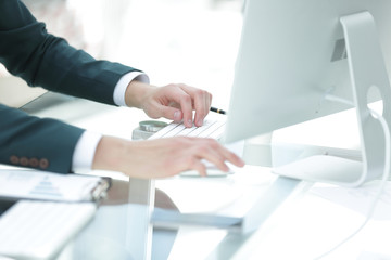 closeup.businessman working on computer in modern office.