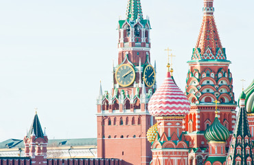 Spasskaya Tower of Moscow Kremlin and the Cathedral of Vasily the Blessed (Saint Basil's Cathedral) on Red Square. Sunny winter day. Moscow. Russia