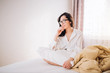© liliyabatyrova - Beautiful woman sitting in bed in morning