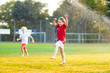 © famveldman - Kids play with water. Child with garden sprinkler.
