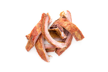 Wall Mural - Smoked ribs on a white background. Smoked ribs close-up on a white background.