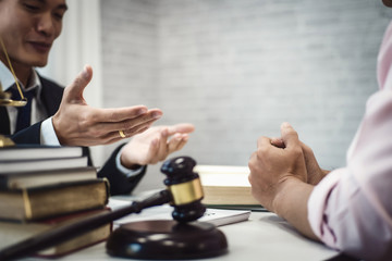 Two male lawyer discussing about contract agreement in courtroom. justice and law ,attorney, court judge, concept.