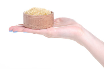 Wall Mural - Rice in wooden bowl in hand on white background isolation