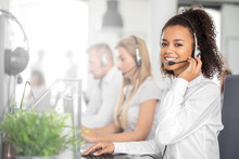 Call Center Worker Accompanied By Her Team.