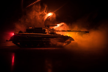 War Concept. Military silhouettes fighting scene on war fog sky background, World War German Tanks Silhouettes Below Cloudy Skyline At night. Attack scene. Armored vehicles. Tanks battle