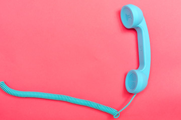 retro phone on a pink paper background