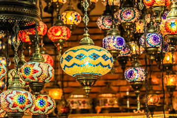 Wall Mural - Traditional bright decorative hanging Turkish lamps and colourful lights with vivid colours  in the Istanbul Bazaar, Turkey