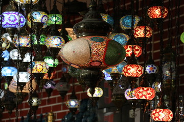 Wall Mural - Traditional bright decorative hanging Turkish lamps and colourful lights with vivid colours  in the Istanbul Bazaar, Turkey