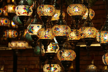 Wall Mural - Traditional bright decorative hanging Turkish lamps and colourful lights with vivid colours  in the Istanbul Bazaar, Turkey